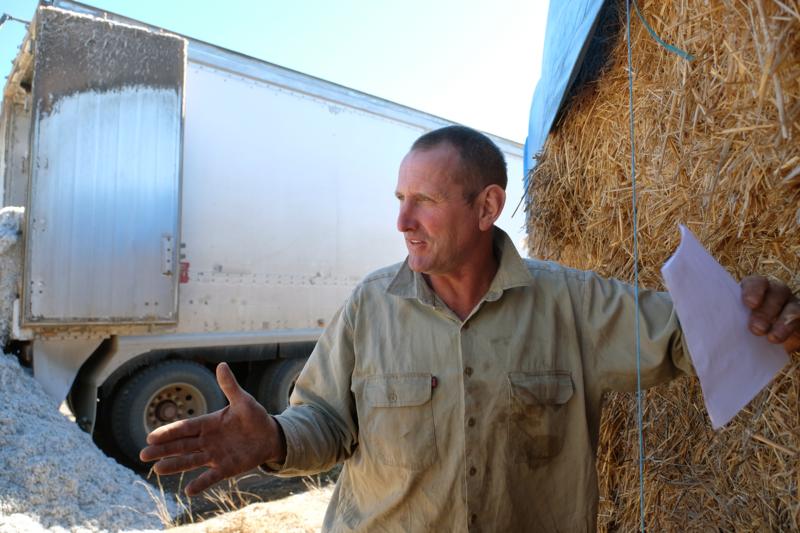 <img alt='Angus Atkinson cattle farmer with hay truck, Coonabarabran NSW'>